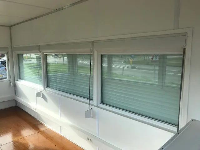 20ft High Cube Observation Office – Shuttered Windows – empty container interior with large windows and wooden floor