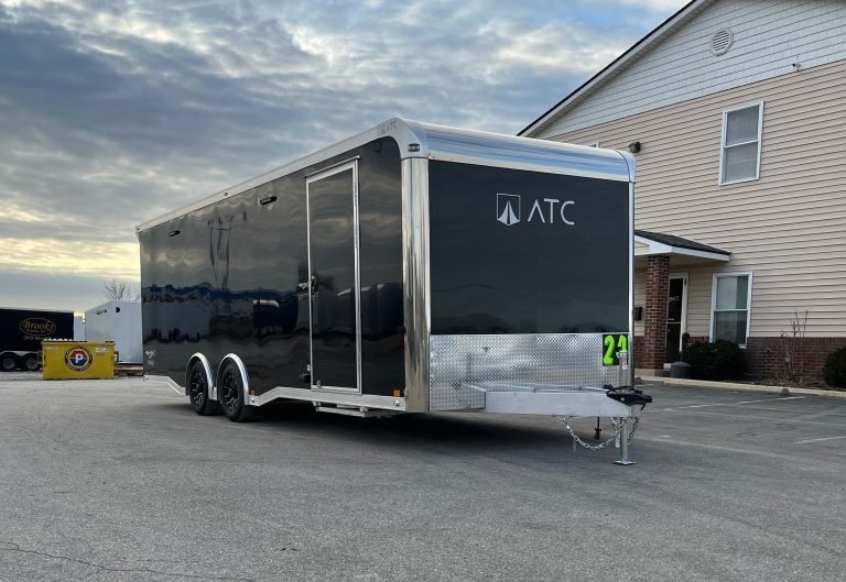 2026 ATC 24 ft Car Hauler – Black, Plus Package – Passenger side view of the black trailer showing the side entry door and wheels