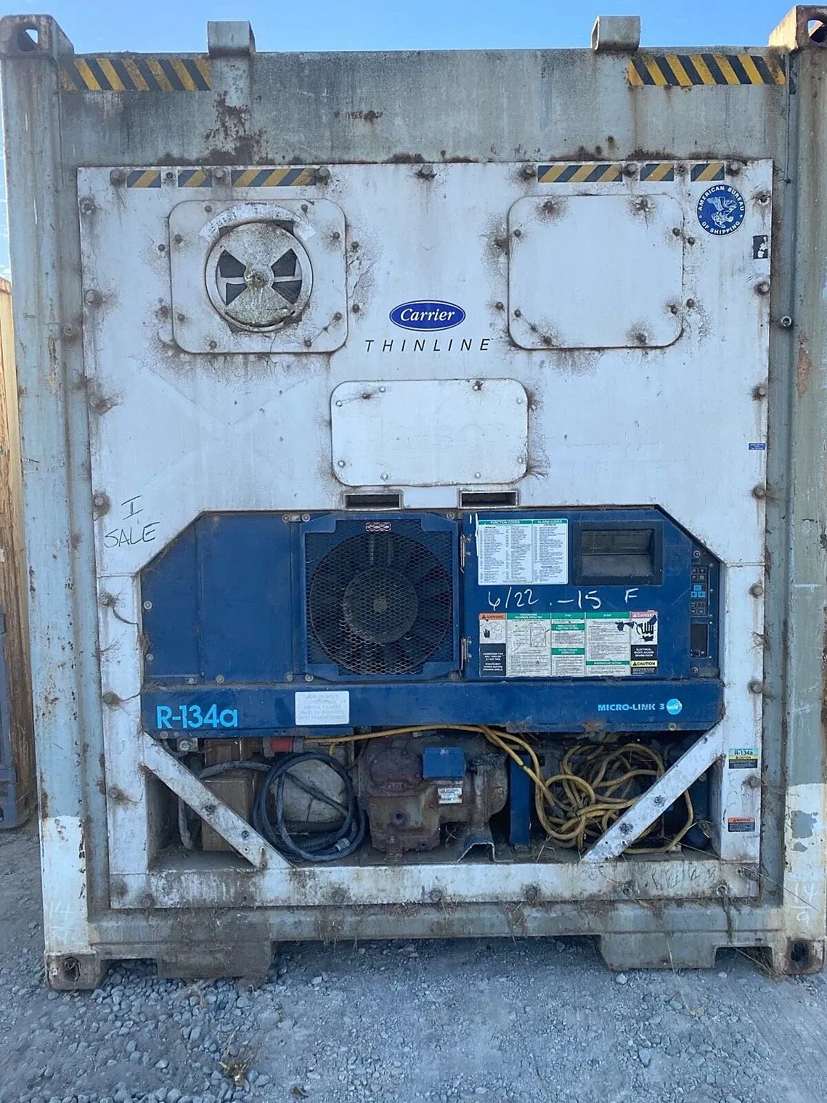 40ft Used Refrigerated Shipping Container – Custom Side Door – Weathered refrigeration unit with exposed compressor, coiled cables, fan grille, and control panel