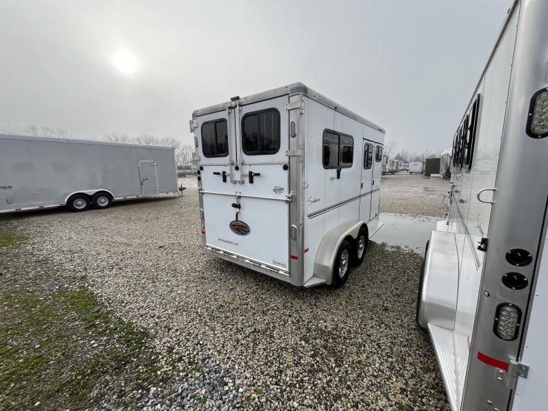 2019 Sundowner Charter 2 Horse Trailer – Warmblood Size – Rear three-quarter view of the trailer showing the closed back doors and side windows