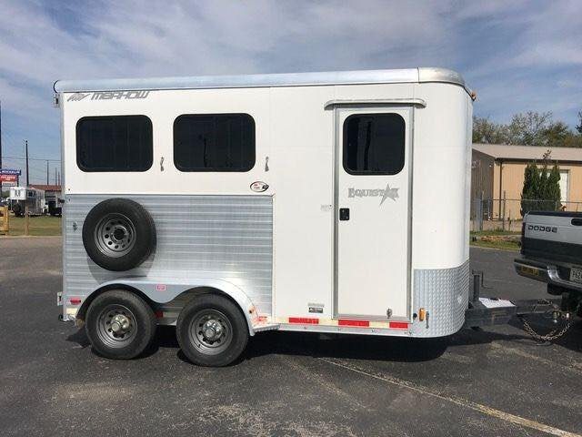 2010 Merhow 2 Horse Slant Trailer – Insulated Roof, Escape Door – Direct side profile of the trailer showing windows and a mounted spare tire