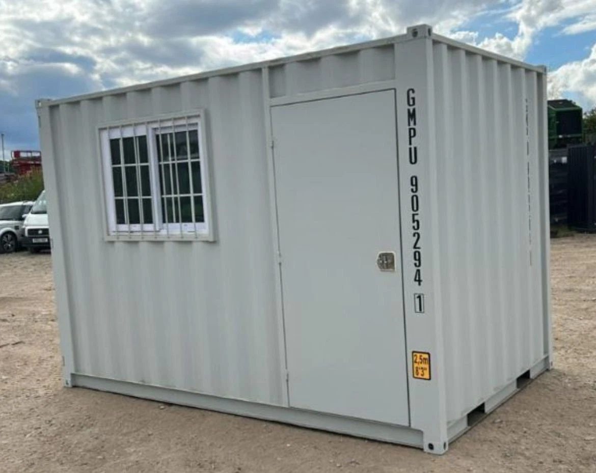 9ft Container Office – Side Entry and Barred Window – three-quarter exterior of container office with barred window and door