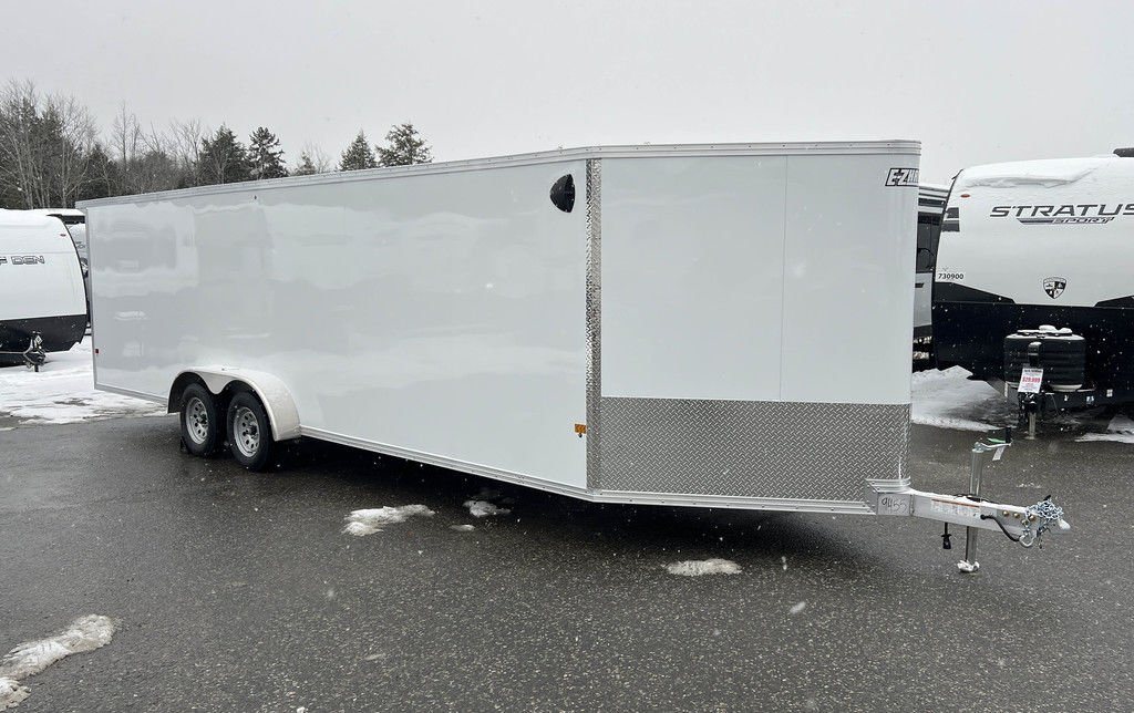 2024 E-Z Hauler 24 ft Trailer – Rear Canopy – Full curbside profile view of the long white enclosed aluminum trailer on pavement