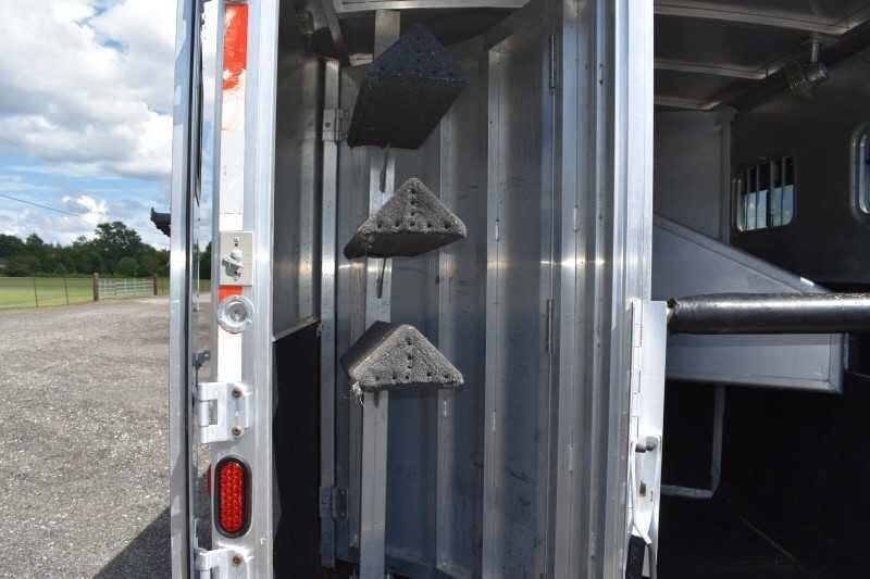 2002 Exiss SS20 2 Horse Trailer – Walk-Through Dressing Room – Close up of saddle racks mounted inside the tack area