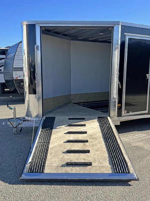 2024 Sno Pro 22 ft Snowmobile Trailer – Extra Height – The front ramp door lowered to the ground with traction mats attached