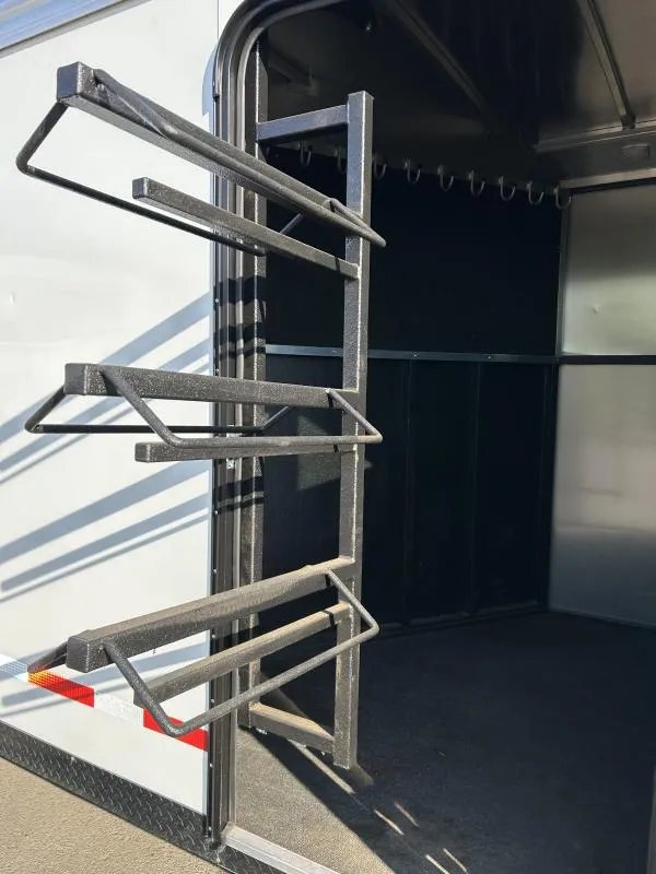 2022 Logan Coach Crossfire 3 Horse Trailer – Swing-Out Saddle Rack – Swing-out saddle rack extended through the open side access door