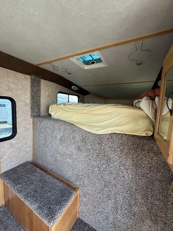 2020 Trails West Sierra 4 Horse Gooseneck – Comfort Package – Living area view showing the bed in the gooseneck section
