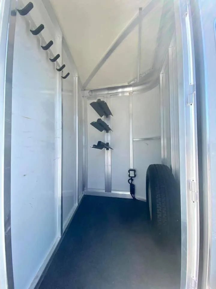 2011 Cimarron 3 Horse Bumper Pull – Insulated Roof – Interior of front tack room with bridle hooks and saddle rack