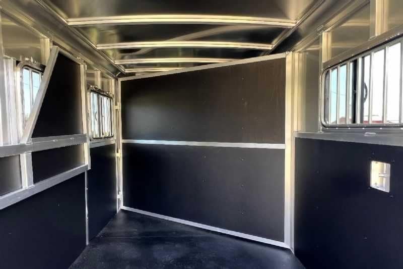 2024 Shadow 2 Horse Bumper Pull Trailer – Aluminum, Dressing Room – Interior horse stall area with a solid black divider closed
