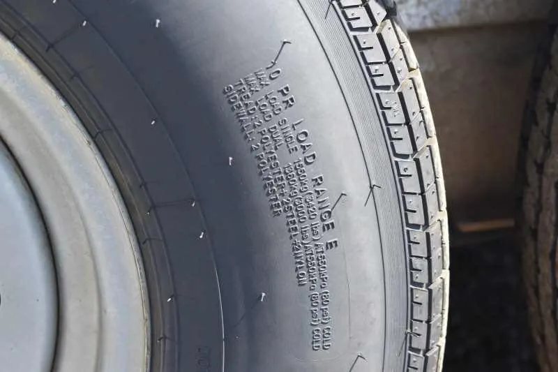 2014 Sundowner 2 Horse Gooseneck Trailer – Electric Jack – Close up view of the tire sidewall showing load range information