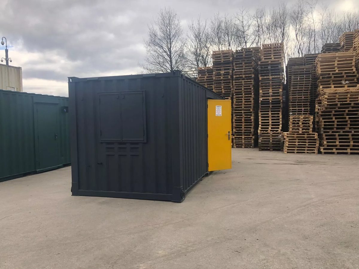 20ft Anti-Vandal Office Canteen – Insulated Steel Workspace – three-quarter exterior of dark modular office with open yellow door