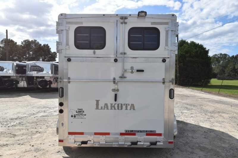 2018 Lakota 2HBPST 2 Horse Trailer – Dressing Room – Rear view of a white horse trailer with closed double doors and logo