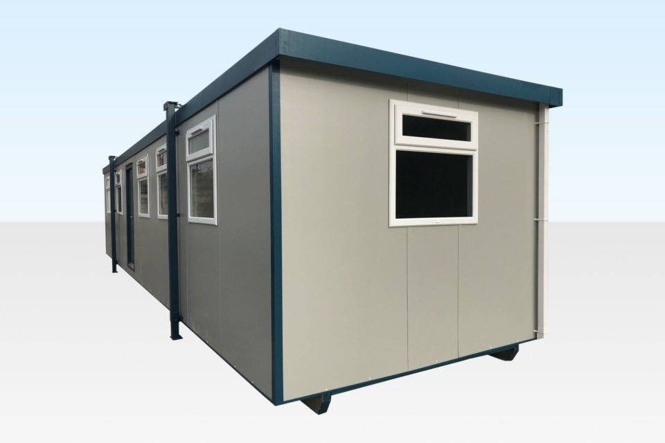 40 ft Jackleg Office Cabin – Blue or White – A light grey portable office cabin with blue trim and multiple windows