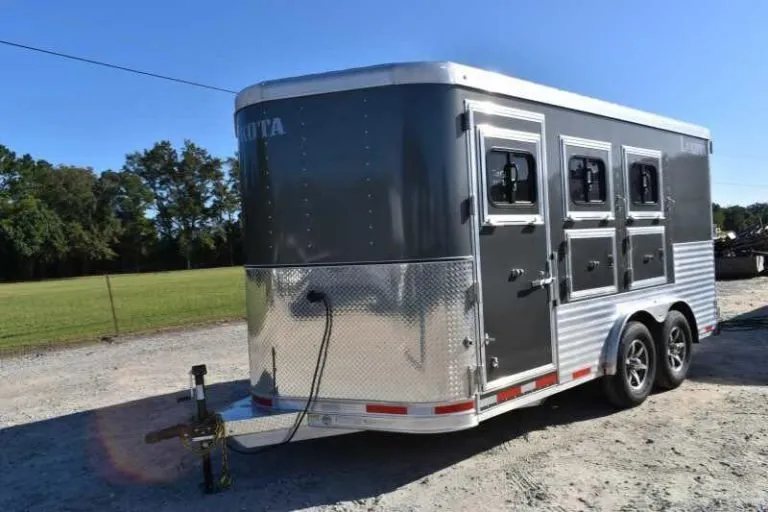 2018 Lakota 83HBPSL 3 Horse Trailer – Aluminum – Front three-quarter angle of a charcoal bumper pull horse trailer