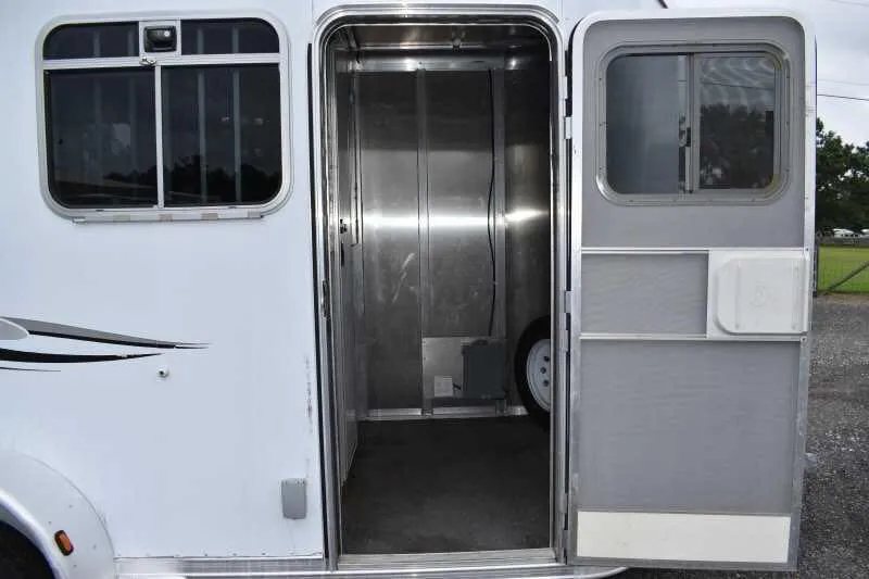 2003 Featherlite 2HST 2 Horse Trailer – Aluminum – Close-up of the open side entry door leading into the interior space
