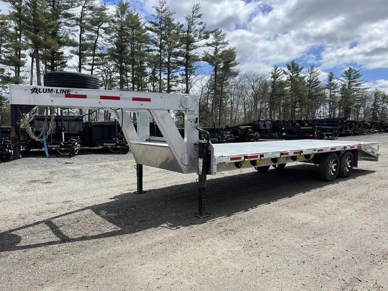2024 Alum-Line 24 ft Gooseneck – Flip-Over Ramps – Side profile view of the white aluminum gooseneck trailer on a gravel lot