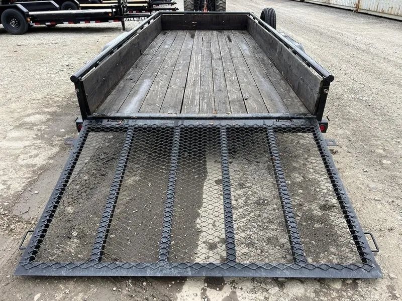 2021 Big Tex 16 ft Utility Trailer – Ramp Gate & Spare – Top-down view of the wooden plank trailer bed from the rear ramp area