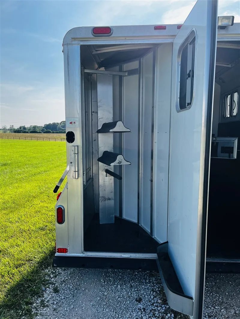 2015 4 Star 2 Horse Bumper Pull – Slant Load, Rear Tack – Rear tack area with saddle racks visible through an open rear door