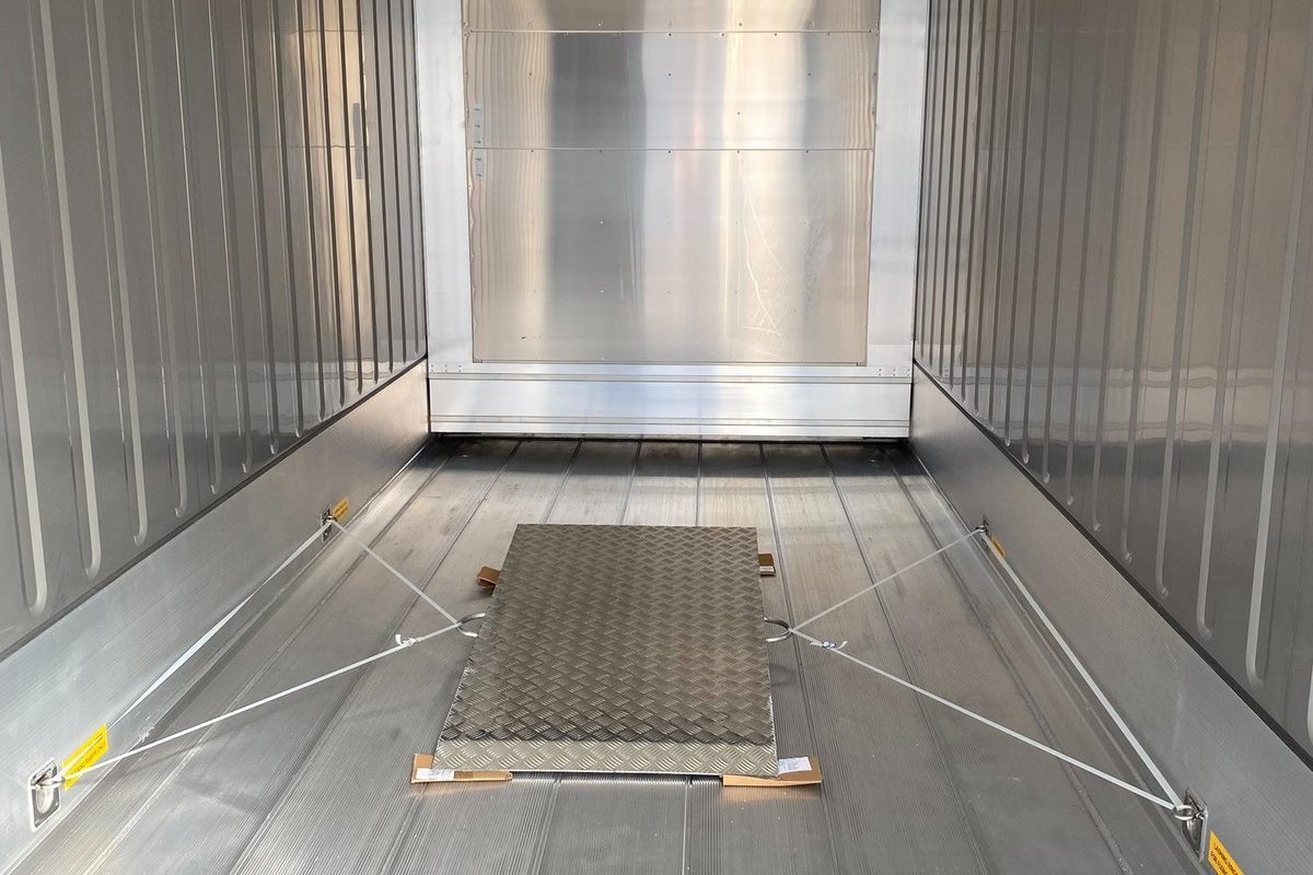 30ft Refrigerated Container – Stationary Cold Storage – Empty refrigerated container interior with secured metal floor panel