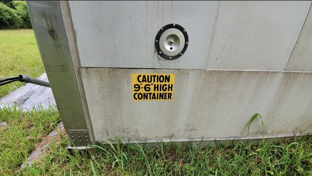 40ft As-Is Insulated Container – Electrical Connection – container exterior connection port and yellow height caution label