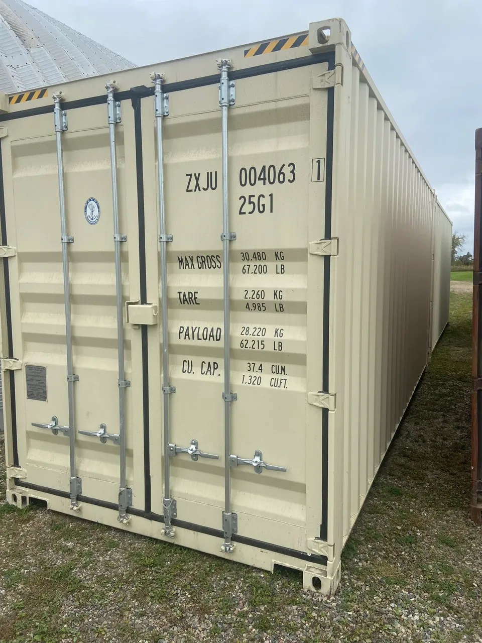 20ft High Cube Shipping Container – One-Trip, Extra Height – three-quarter exterior view of cream container with closed cargo doors