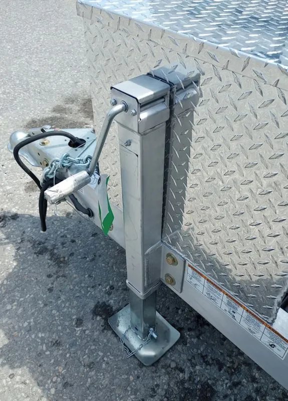 2025 Mission Trailers 16 ft Dump Trailer – Aluminum – Close up of the trailer jack and coupler on the tongue