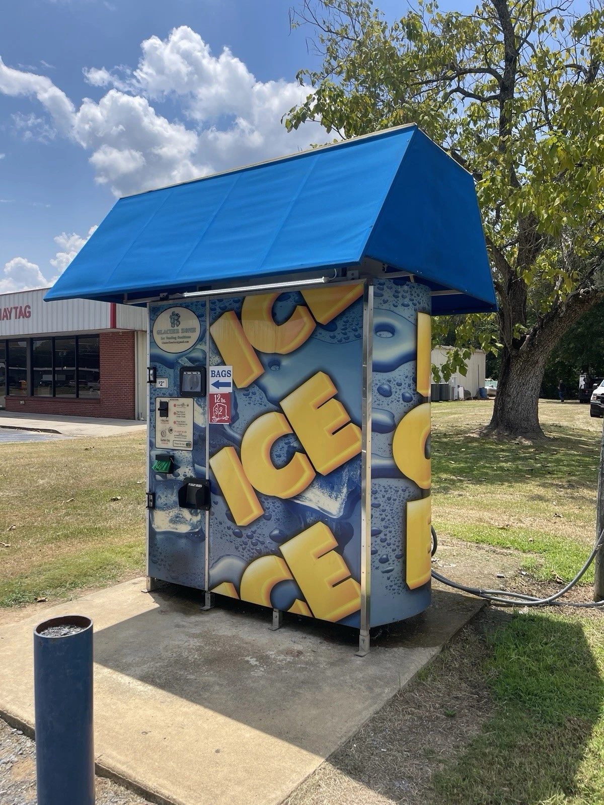 Commercial Ice Vending Machine – Bagged and Bulk Dispensing – outdoor ice vending machine beneath a large blue canopy