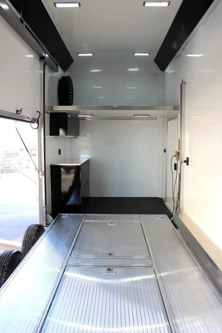 2026 ATC 26 ft Stacker Trailer – Tiltable Lift – View looking towards the front of the trailer showing cabinets and upper deck