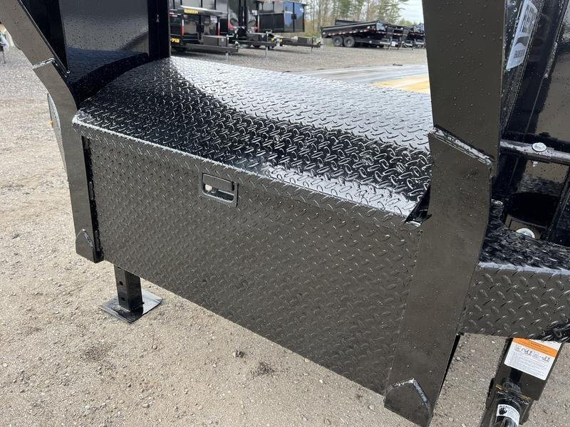 2024 Diamond C 35 ft Equipment Trailer – Auto Dovetail – Closed black diamond-plate storage box on the front of the trailer