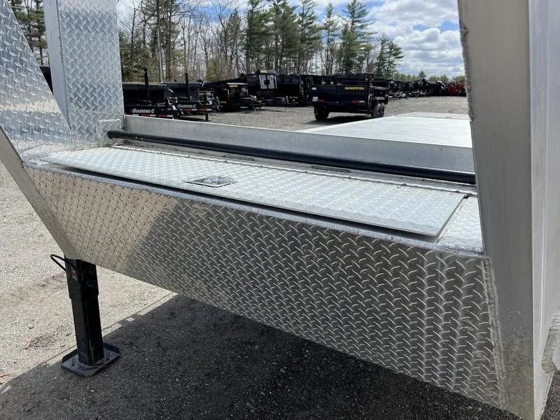 2024 Alum-Line 24 ft Gooseneck – Flip-Over Ramps – A closed aluminum tool box with diamond plate texture on the trailer frame