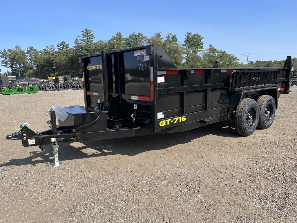 2024 Griffin Trailers 16 ft Dump Trailer – Telescopic – A three-quarter exterior view of a black telescopic dump trailer on gravel