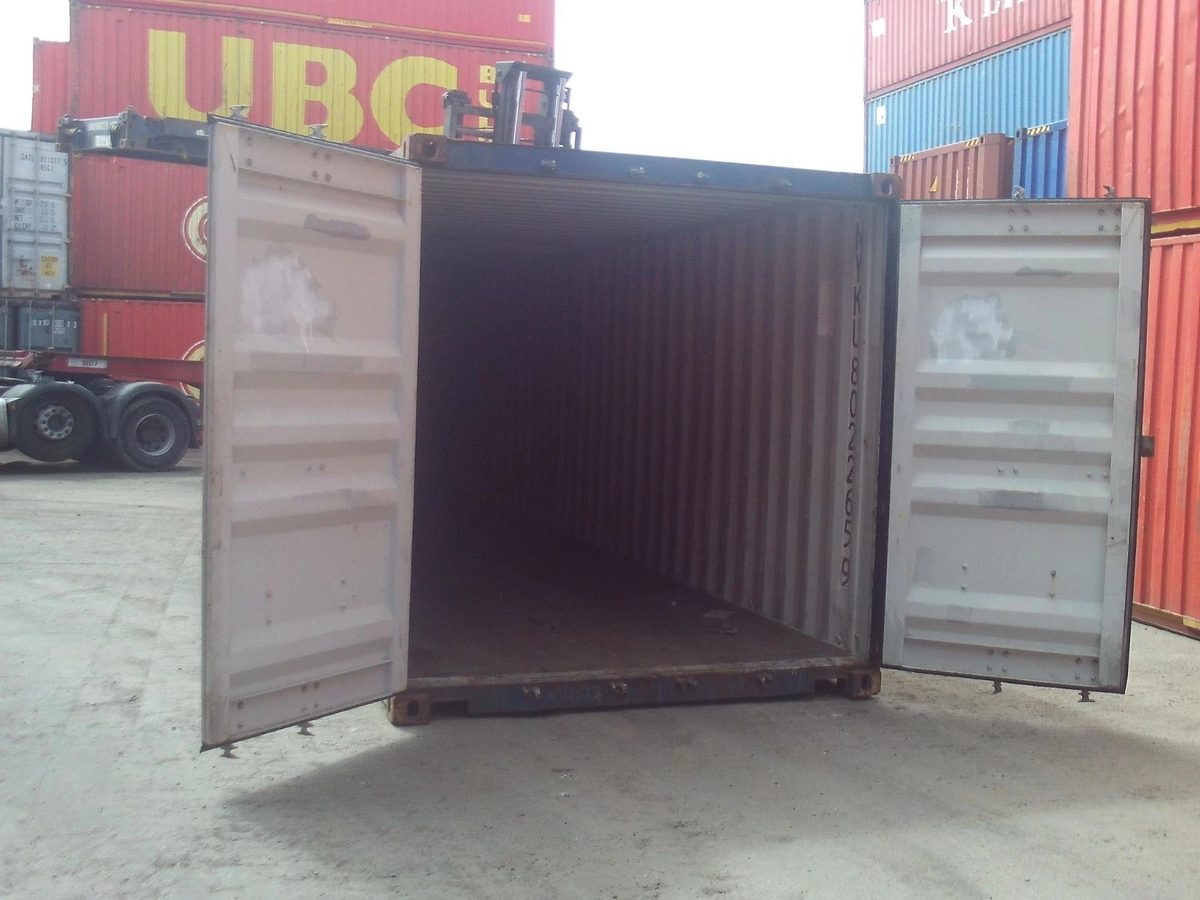 40ft Used Shipping Container – Standard Height, Double Doors – open cargo doors revealing empty container in stacked container yard
