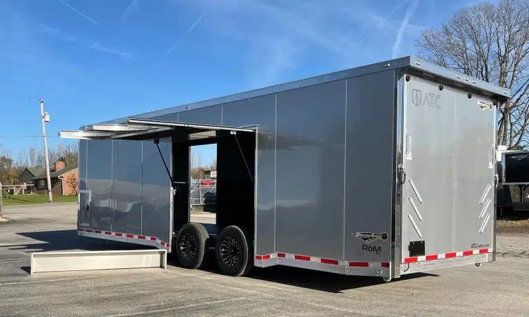 2026 ATC 28 ft Car Trailer – Silverfrost, LifeTrac – Exterior three-quarter rear view with the large side escape door fully opened up