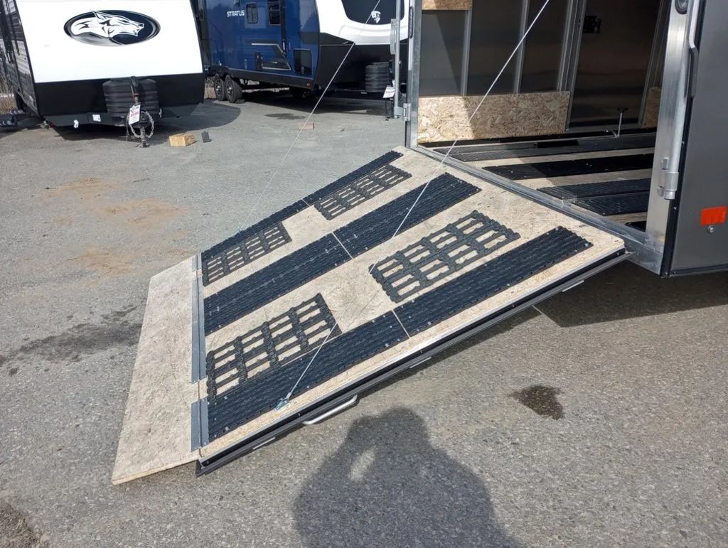 Mission Trailers Aluminum Crossover – Rear Canopy – Angled view of the open rear ramp door with traction mats installed