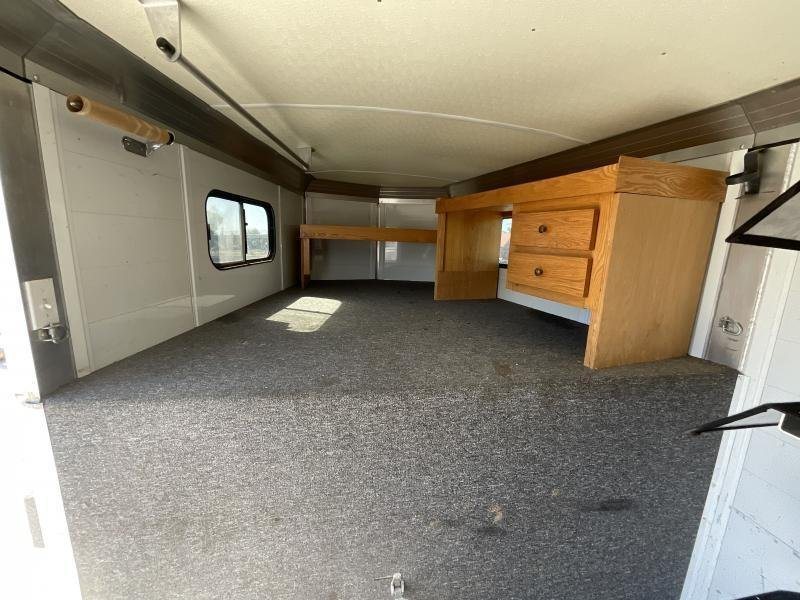 2005 Jamco 4 Horse Gooseneck Trailer – Blue, Air Suspension – Gooseneck sleeping or storage area with a wooden desk unit