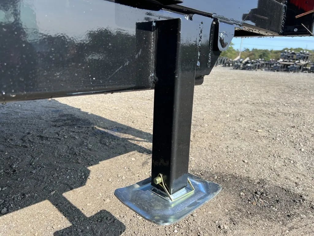 2024 Griffin Trailers 16 ft Dump Trailer – Telescopic – A close-up view of the adjustable trailer stabilizer leg with footpad