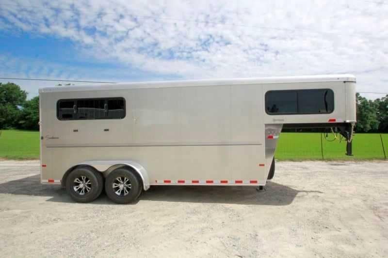 2016 Sundowner 3 Horse Gooseneck – Aluminum, Dressing Room – Full side view of the curb side showing windows and tandem aluminum wheels