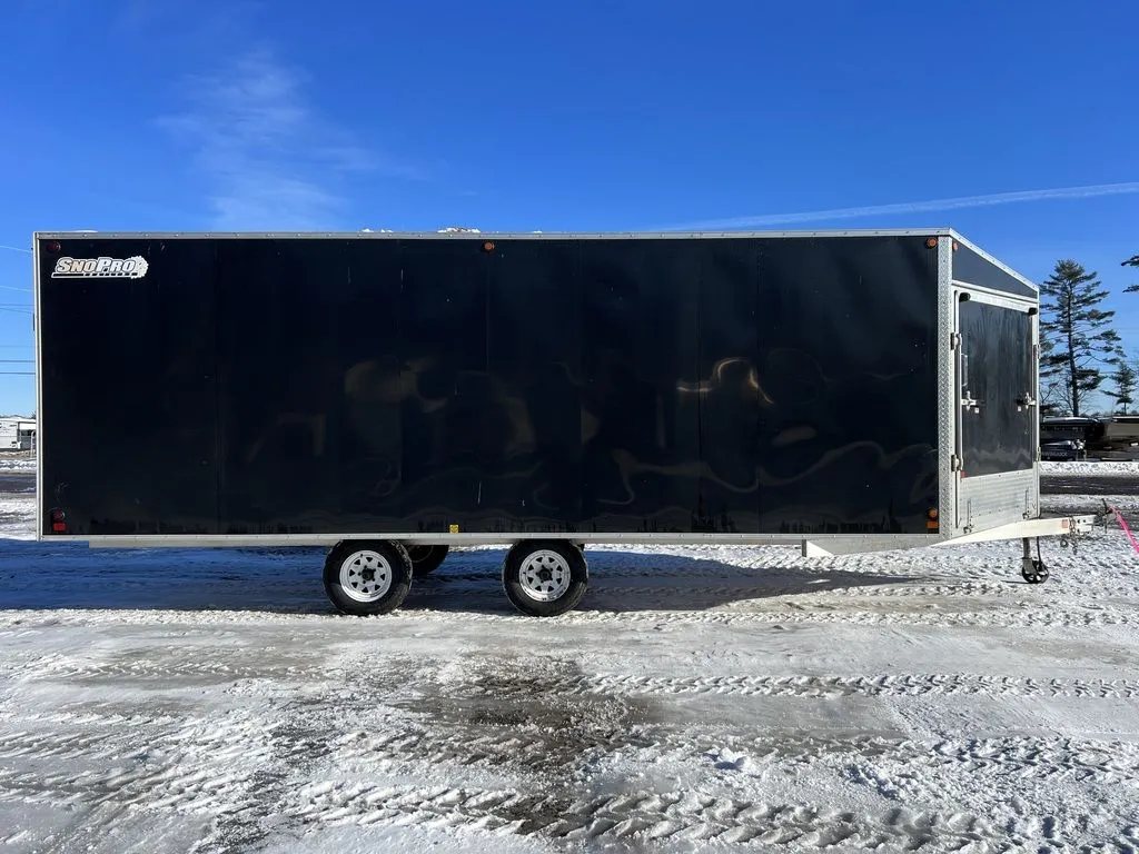 2008 Sno Pro 4-Place Snowmobile Trailer – Black Aluminum – Full profile side view of the black four-place enclosed trailer