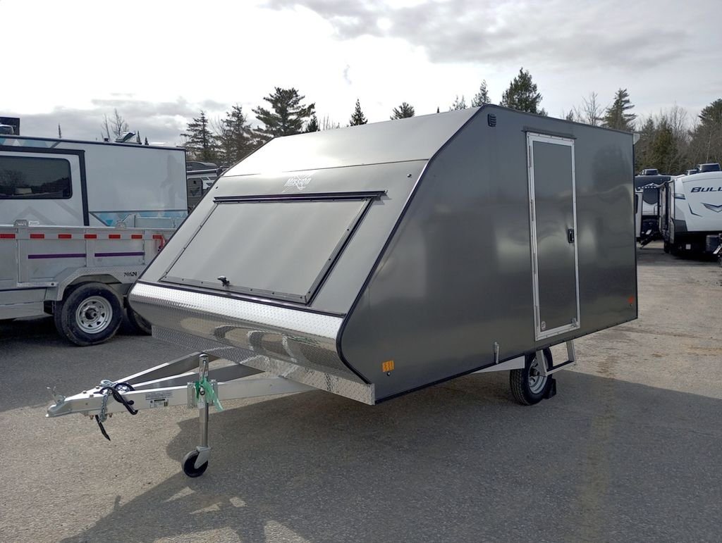 Mission Trailers Aluminum Crossover – Rear Canopy – Front three-quarter view of a charcoal gray crossover trailer with a side door
