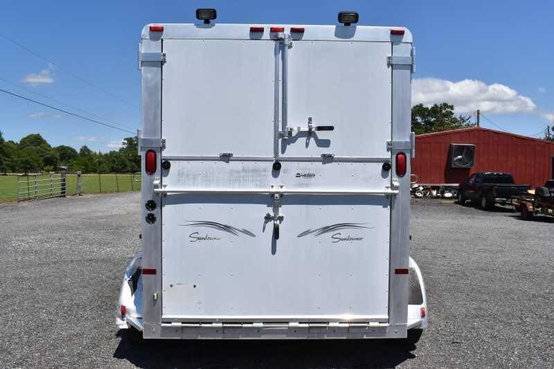 2000 Sundowner 2 Horse Gooseneck Trailer – Dressing Room – The rear of the horse trailer with doors closed showing graphics