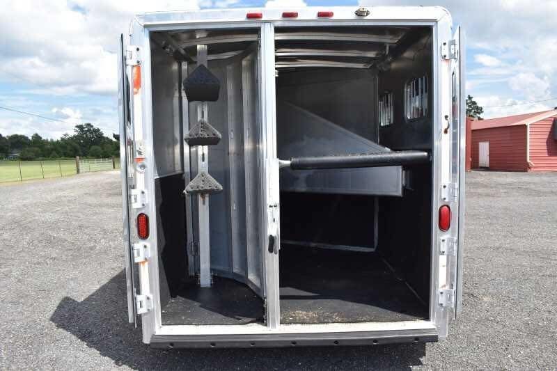 2002 Exiss SS20 2 Horse Trailer – Walk-Through Dressing Room – Rear view looking into the horse stalls with the doors open