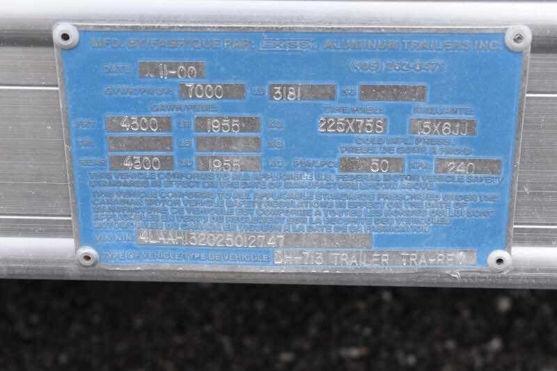 2002 Exiss SS20 2 Horse Trailer – Walk-Through Dressing Room – Close up of the blue manufacturer VIN plate with vehicle specifications