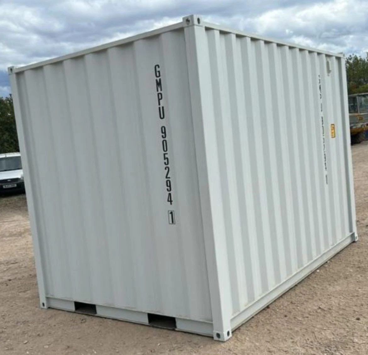 9ft Container Office – Side Entry and Barred Window – three-quarter exterior view of container with blank corrugated walls