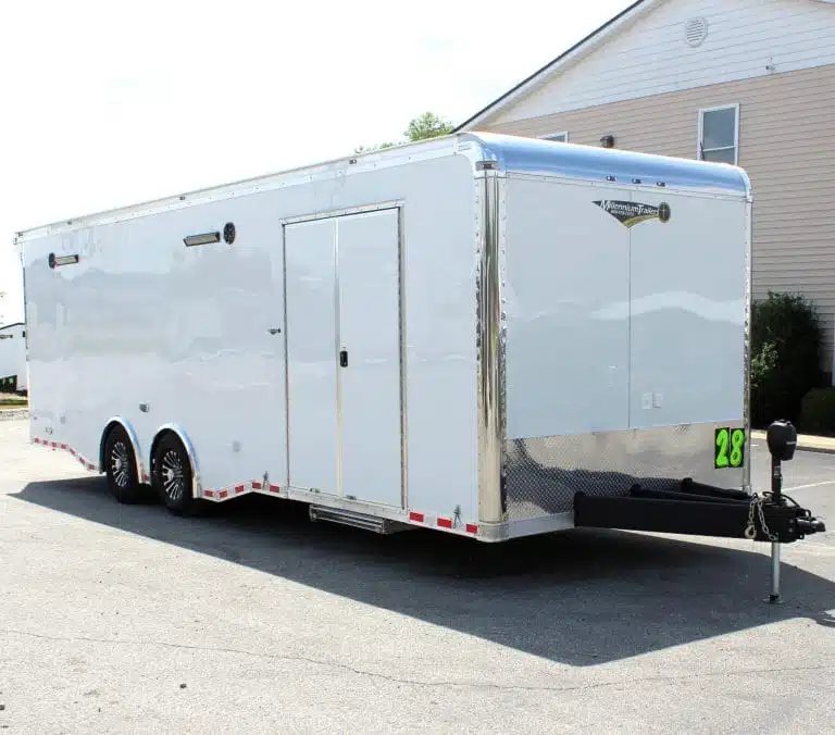 2025 Haulmark Edge 28 ft Enclosed Car Trailer – White – White enclosed car trailer exterior with double side doors and chrome trim details