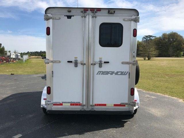2010 Merhow 2 Horse Slant Trailer – Insulated Roof, Escape Door – Rear view of the trailer showing closed double doors and manufacturer decals