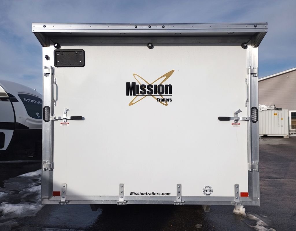 2024 Mission Trailers 24 ft Deckover – Galvanized Package – Straight-on rear view of the closed ramp door with manufacturer logo