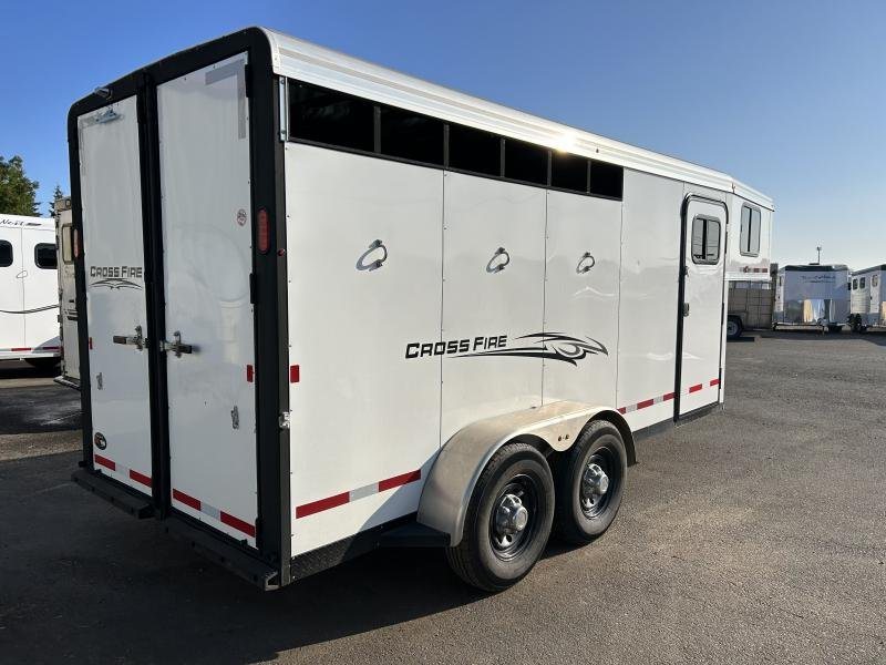 2022 Logan Coach Crossfire 3 Horse Trailer – Swing-Out Saddle Rack – Rear three-quarter view showing closed double doors and side panel decals