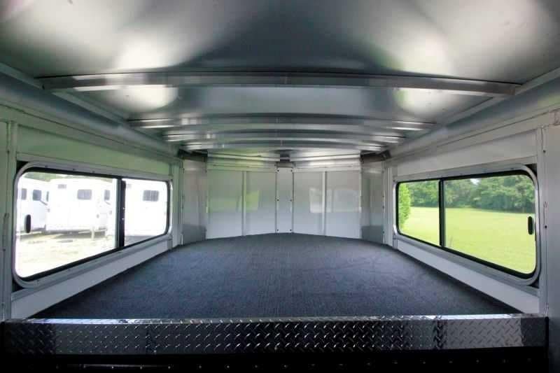 2016 Sundowner 3 Horse Gooseneck – Aluminum, Dressing Room – Interior carpeted sleeping area in the gooseneck with large side windows and metal ceiling