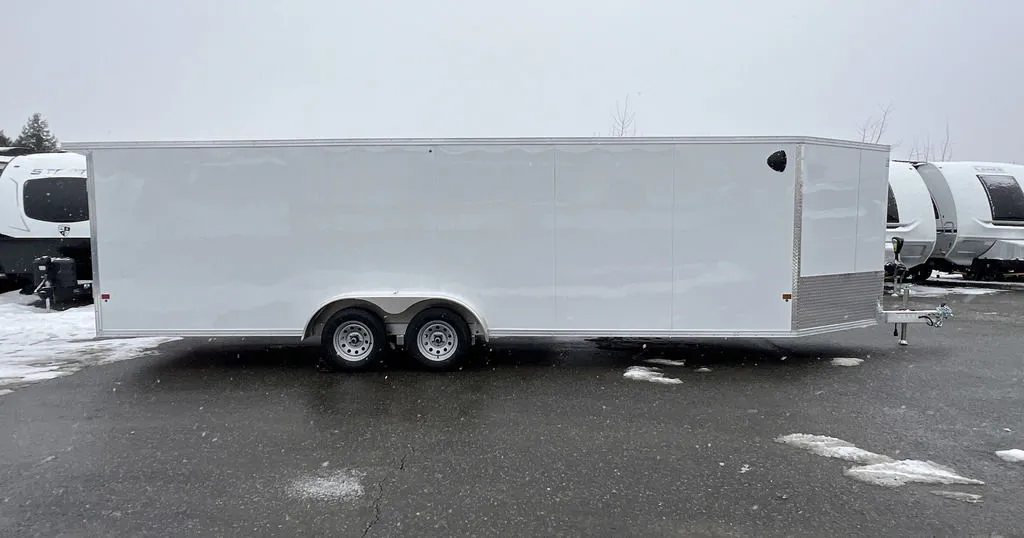 2024 E-Z Hauler 24 ft Trailer – Rear Canopy – Roadside profile view of the white enclosed trailer in a lot