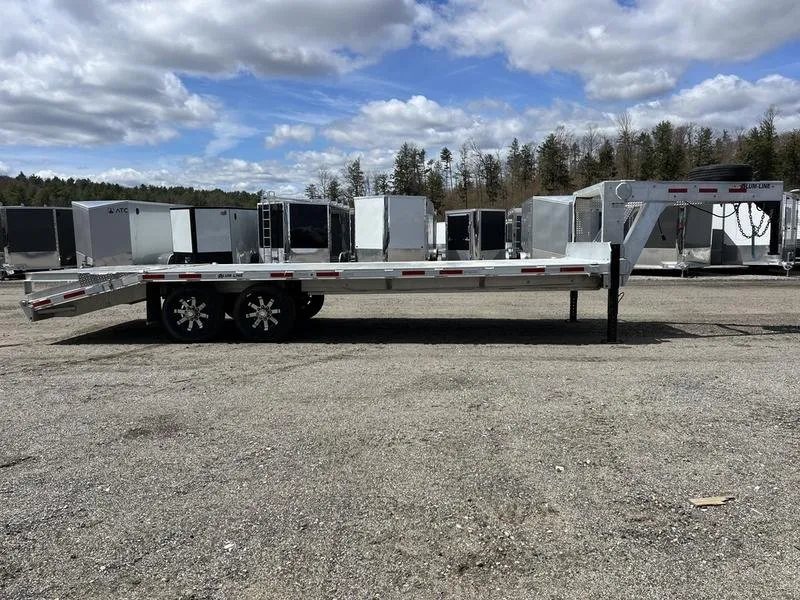 2024 Alum-Line 24 ft Gooseneck – Flip-Over Ramps – Full length side view of the gooseneck trailer against a clear sky